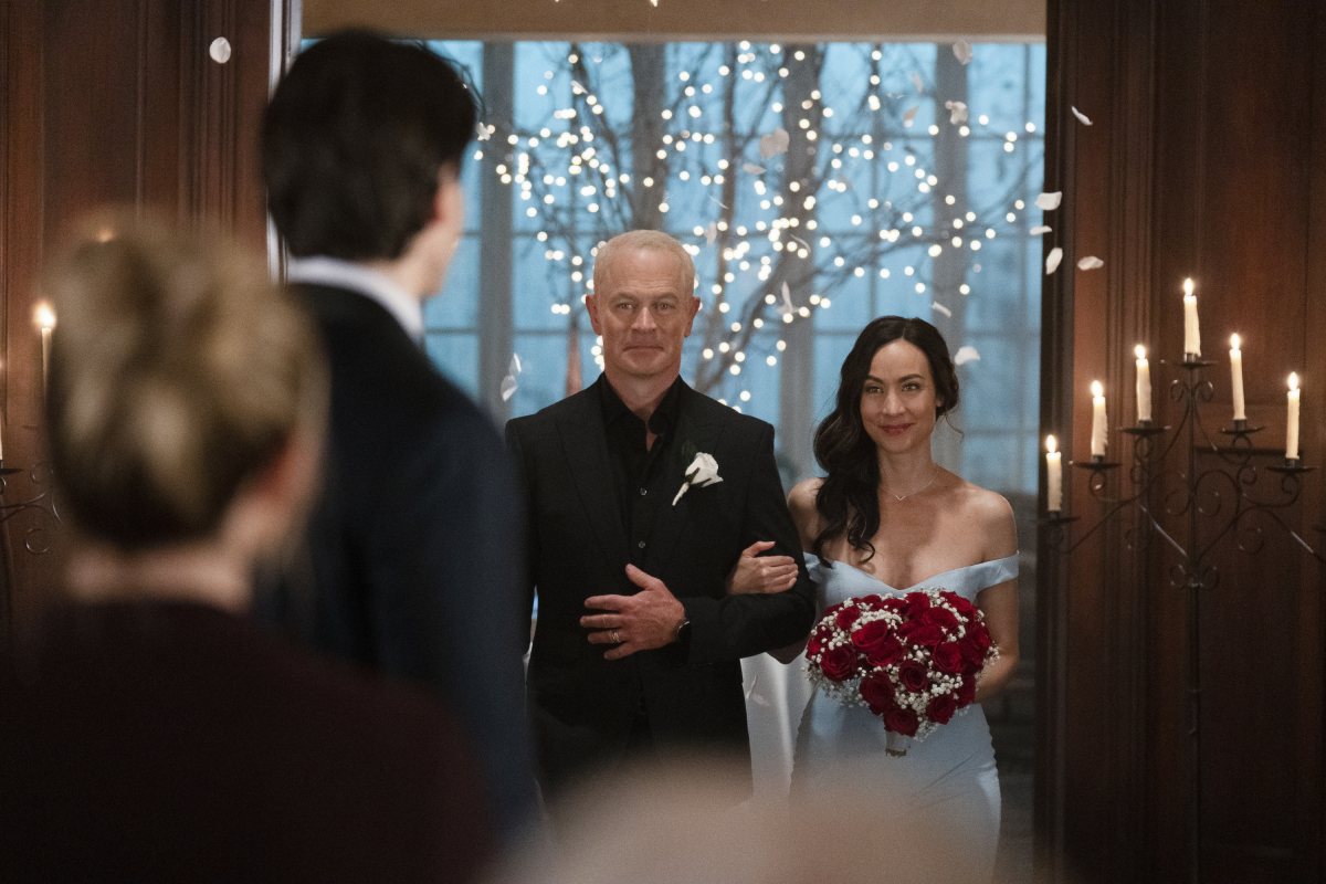 Pictured (L-R): Neal McDonough as Damien Darhk and Courtney Ford as Nora Da...